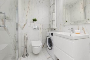 Shower, hair dryer, towels, soap