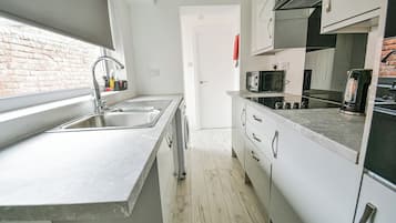 Fridge, microwave, oven, cookware/dishes/utensils
