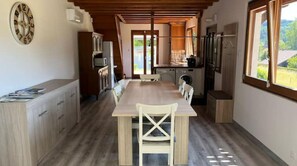 Enjoy meals in the spacious kitchen and dining area with a central island and seating for four.