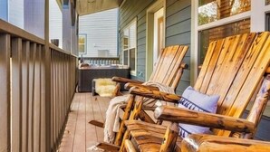 A wooden deck with Adirondack chairs and a bench, overlooking a residential area. - Fall Dollywood Magic! HotTub, Arcade, Game Room, Dog OK, 2 Suites, A+ location (Sevierville)