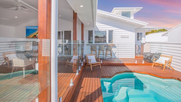 A modern deck with a pool, glass railings, and outdoor seating. - Bohemian Coastal Dream (Port Macquarie)