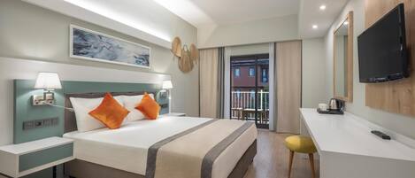 A hotel room with a bed, bedside lamps, a desk with a chair, a TV, and a balcony view.
