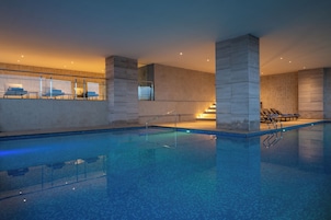 Outdoor pool, open 6:00 AM to 10:00 PM, sun loungers