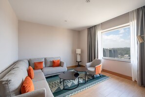 Executive Suite | Living area | 65-inch Smart TV with satellite channels - Hyatt Regency Nairobi Westlands (Nairobi)