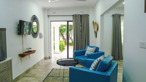 Deluxe Double or Twin Room | Living area | 42-inch LCD TV with satellite channels - Zambezi Boutique  (Victoria Falls)