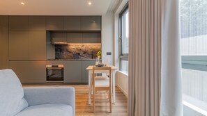 Deluxe Studio (4) | Living area | Flat-screen TV