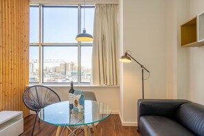 Standard Studio | Living area | 1-inch flat-screen TV with cable channels - Boavista 1774 by LovelyStay (Porto)