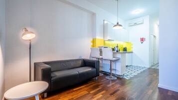 Standard Studio | Living area | 1-inch flat-screen TV with cable channels