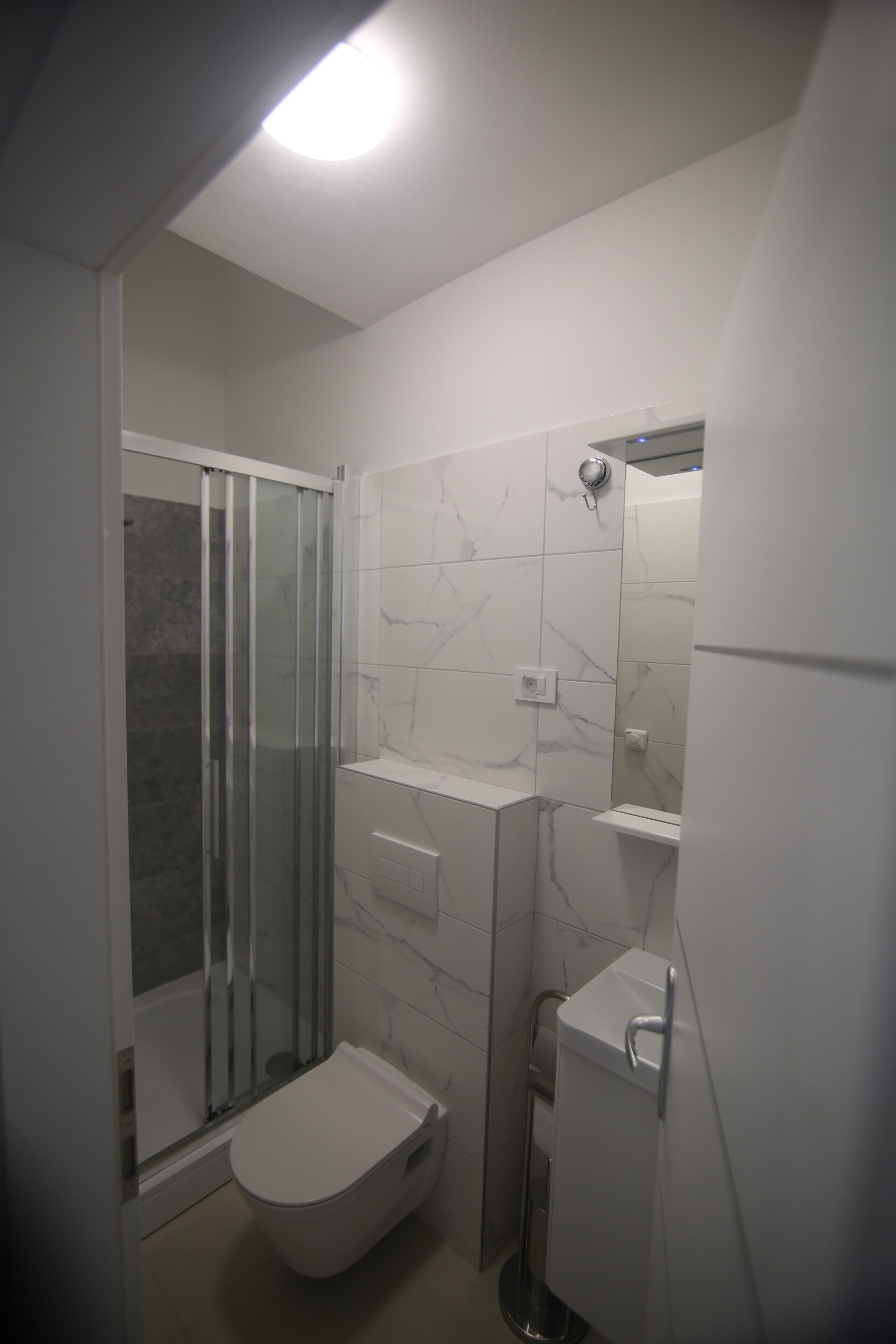 Shower, towels, soap, toilet paper