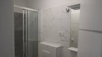 Shower, towels, soap, toilet paper