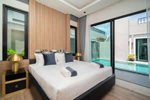 4 Bedroom Deluxe Pool Villa | In-room safe, desk, blackout drapes, iron/ironing board