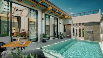 Una piscina al aire libre, sillones reclinables de piscina