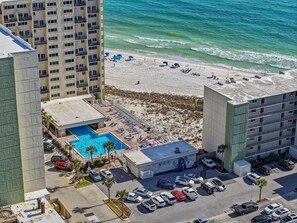 A hotel with a rooftop pool, beach access, and parking.
