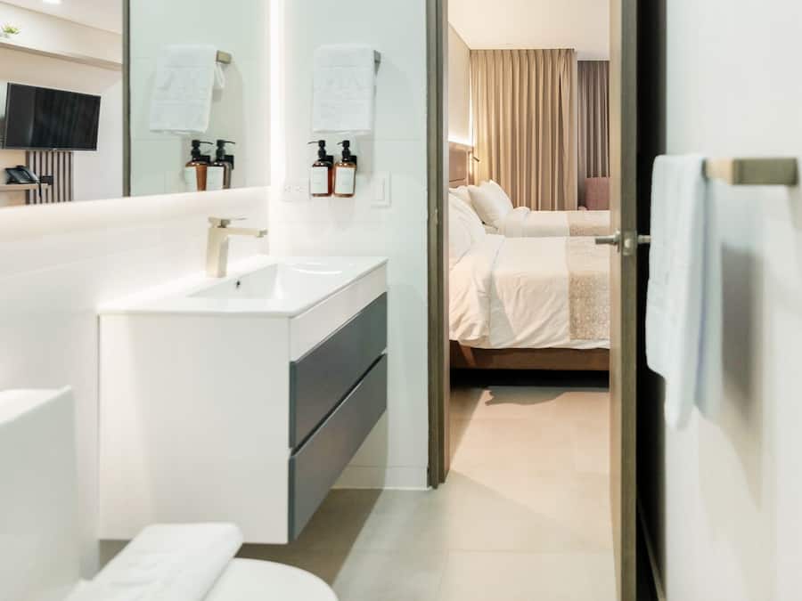 Junior Room, Kitchenette | Bathroom | Shower, rainfall showerhead, hair dryer, bathrobes