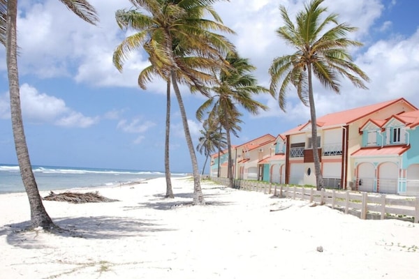 On the beach, sun loungers, beach towels