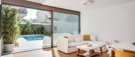 Signature Apartment | Living area | 50-inch Smart TV with digital channels, Netflix, streaming services