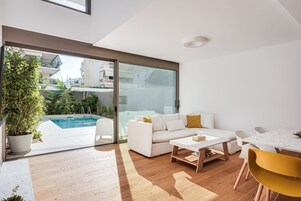 Apartamento Signature | Zona de estar | Smart TV de 50 pulgadas con canales digitales, Netflix