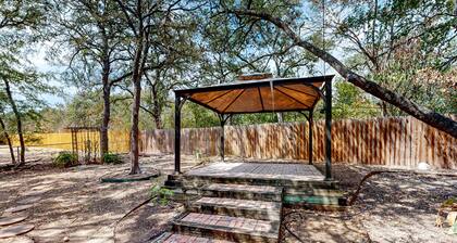 Dog-friendly home with huge yard, covered patio, & fireplace