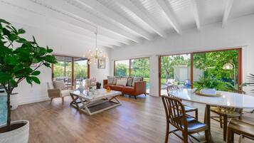 Deluxe Apartment | Living area | 50-inch Smart TV with cable channels