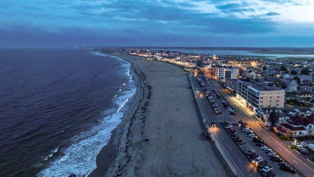 A coastal cityscape with a beach, roads, and buildings. - The Salty Oyster - Amazing Deck and Short Walk to beach! (Hampton)