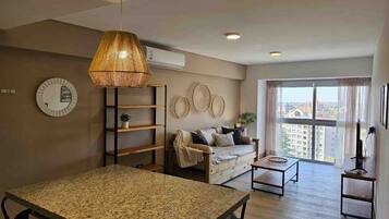 Apartment | Living area | 40-inch Smart TV with cable channels, Netflix, pay films