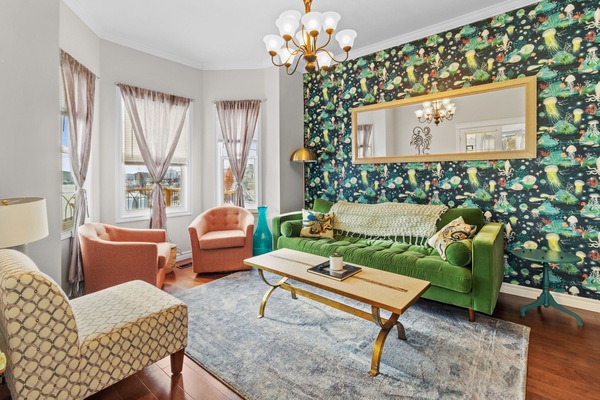 Relax in the inviting living space surrounded by comfy sofas - the perfect spot to unwind after a day of adventures! 🛋️✨