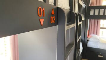 A bunk bed with two levels, each marked with numbers 01 and 02.