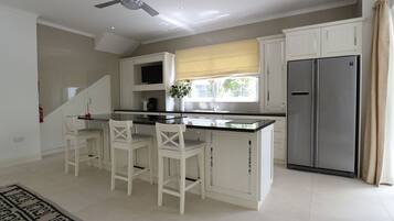 Luxury Villa | Private kitchen | Full-sized fridge, microwave, oven, stovetop