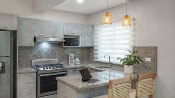 Coffee/tea maker, fridge, microwave, oven