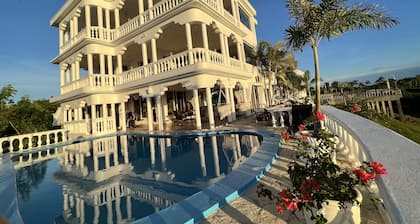 Room w/ ocean view balcony next to the beach. 2 pools, fire pit, gardens & more!