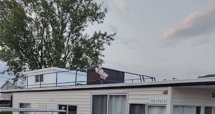 Unique houseboat rental with private dock and land on the historic Rideau River.