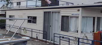 Unique houseboat rental with private dock and land on the historic Rideau River.