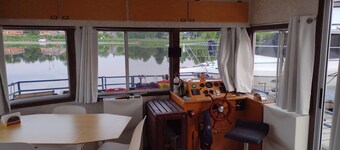 Unique houseboat rental with private dock and land on the historic Rideau River.