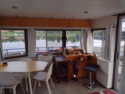 Unique houseboat rental with private dock and land on the historic Rideau River.