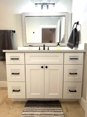 Shower, hair dryer, towels, toilet paper