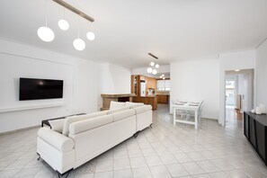 Comfort Apartment, 1 Bedroom, Sea View | Living area | 55-inch Smart TV with digital channels, Netflix, streaming services