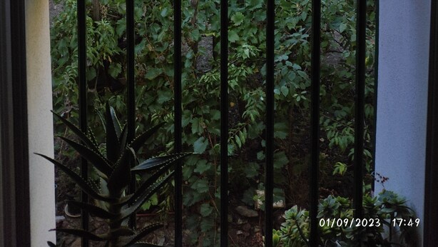 A balcony with a view of a hilly landscape, including houses and greenery. - 2.5 km from the sea of Levanto, on the first hill, in a green and quiet location (levanto)
