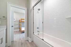 Combined shower/bathtub, hair dryer, towels - Sunrise Beach House | Heated Pool, Beach Access, New Build | My Beach Getaways (Gulf Shores)