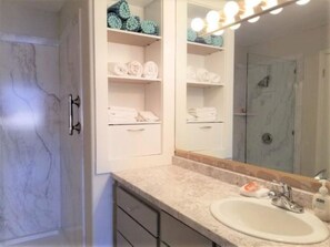 Shower, hair dryer, towels