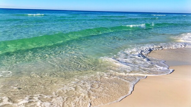 A beach with clear turquoise water and a sandy shore. - Ground Floor, Close to Beach, Pet Friendly Free Wifi/Beach Svs 2 Pools, New Mgmt (Miramar Beach)