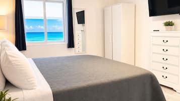 Premium bedding, memory-foam beds, desk, laptop workspace