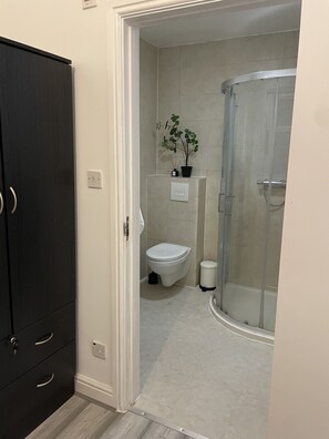 Shower, towels, toilet paper