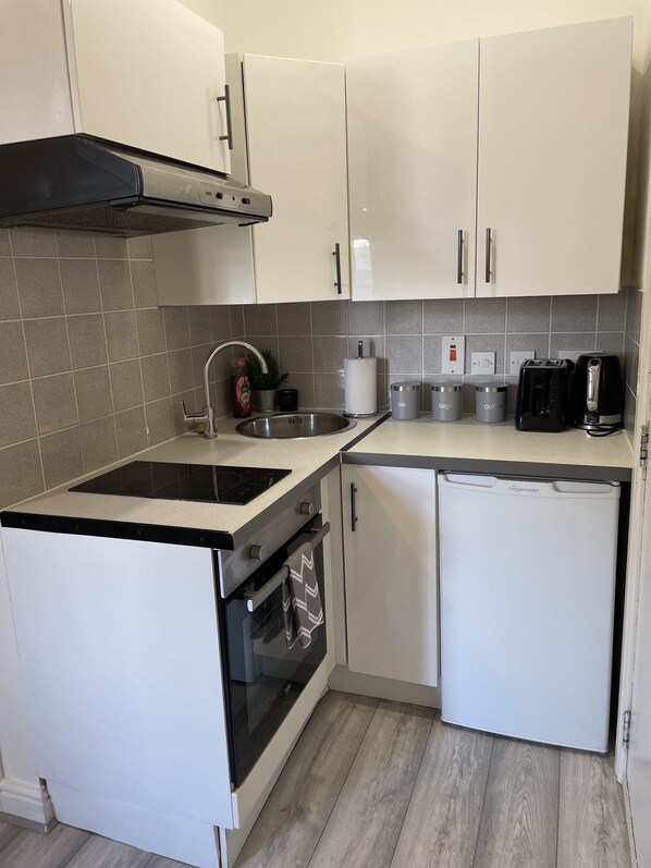 Fridge, oven, electric kettle, toaster