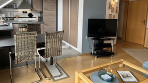 A modern apartment with a kitchen, dining area, and living room. - Müller (App. 11 ) by Interhome (Zinnowitz)