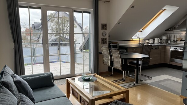 A modern apartment with a living room, dining area, and kitchen. - Müller (App. 11 ) by Interhome (Zinnowitz)