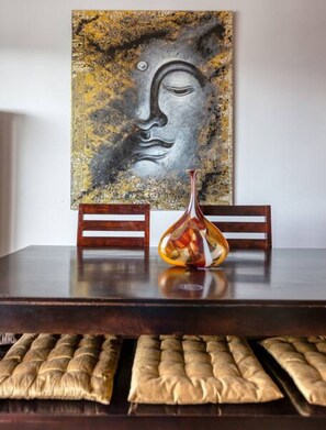 A dining table with two chairs, a vase, and a cushion. - Stunning 3BR Marina View APT in Pieta with Balcony (Tal-Pietà)