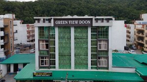 A building named "Green View Doun" with multiple floors and a green roof. - Home Stay Green View Doon (Dehradun)