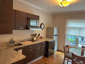 Fridge, microwave, stovetop, coffee/tea maker