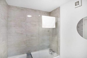 Bathtub, hair dryer, towels