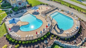 A large outdoor swimming pool with a deck area, surrounded by lounge chairs and umbrellas. - 5BR Retreat Sleeps 16 | Hot Tub, Game Room (Hollister)